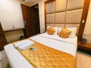 Postel nebo postele na pokoji v ubytování Apex Hotel