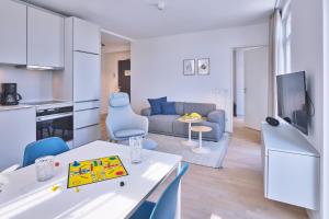 TV a/nebo společenská místnost v ubytování Lüttjeod Apartmentvilla Lüttjeod Apartmentvilla 08