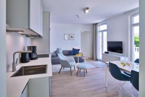 TV a/nebo společenská místnost v ubytování Lüttjeod Apartmentvilla Lüttjeod Apartmentvilla 08