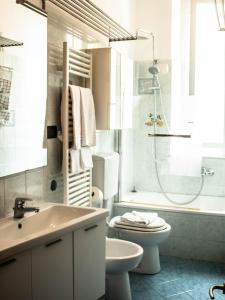 a bathroom with a sink and a toilet and a shower at Soffio Di Mare in Camogli
