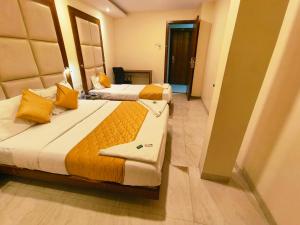 Postel nebo postele na pokoji v ubytování Apex Hotel