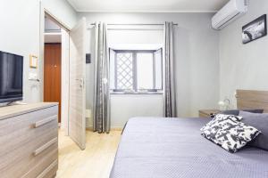 A bed or beds in a room at Mary's House