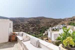 a view from the balcony of a house at Platia Tinos Cycladic Cottage in Platiá