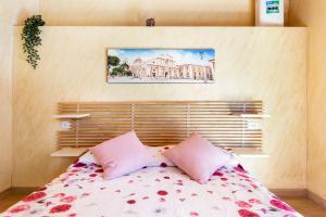 A bed or beds in a room at Mary's House