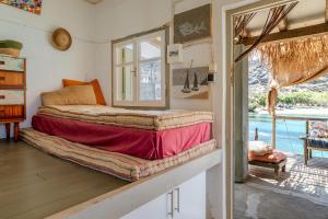 Ένα ή περισσότερα κρεβάτια σε δωμάτιο στο Magical Retreat Tinos