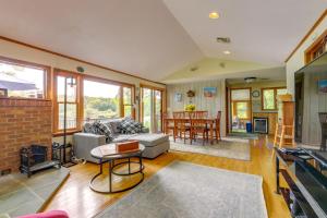 a living room with a couch and a table at Lakefront Connecticut Retreat Near UConn in Coventry