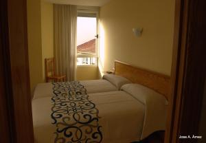 Postel nebo postele na pokoji v ubytování Hostal Orejas + 37 fotografií