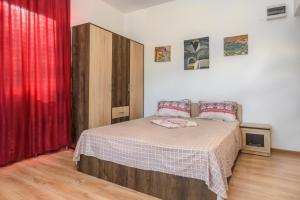 Postel nebo postele na pokoji v ubytování Vila Eliade