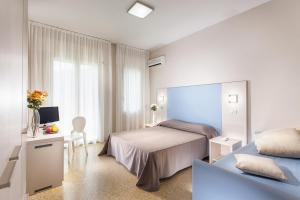 Postel nebo postele na pokoji v ubytování New Hotel Chiari + 34 fotografií