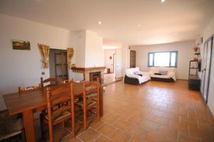 a living room with a table and a couch at RA694 Casa con piscina de 4 dormitorios in Cuevas del Almanzora