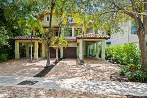 a house with a large driveway in front of it at Casa Central: In the Heart of Fort Lauderdale! in Fort Lauderdale