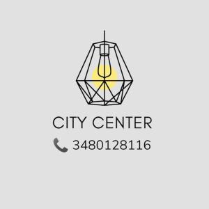 a logo for a city center with a light bulb at CITy CENTER in Cosenza