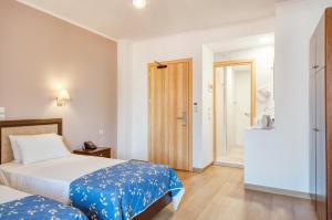 Postel nebo postele na pokoji v ubytování Oscar Hotel