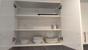 A kitchen or kitchenette at Helena Stúdió Apartman