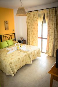 Posteľ alebo postele v izbe v ubytovaní Hostal Malia