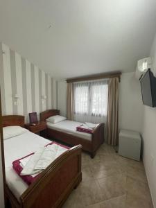 Postel nebo postele na pokoji v ubytování Hotel Grbalj