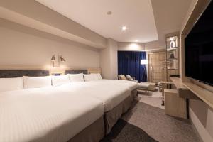 Postel nebo postele na pokoji v ubytování Hotel Keihan Nagoya