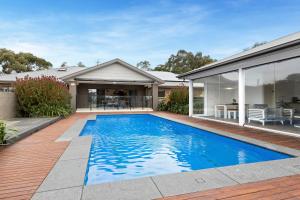 a swimming pool in the backyard of a house at 5BR House Birdwatcher Reedy wetland-SP GROUP in Leopold