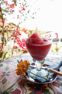 a drink in a martini glass sitting on a table at Agriturismo Morani in Santa Severa