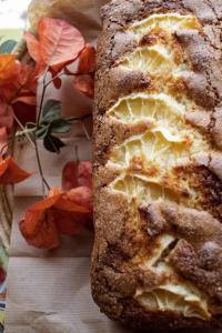 a loaf of bread on a table with orange flowers at Agriturismo Morani in Santa Severa