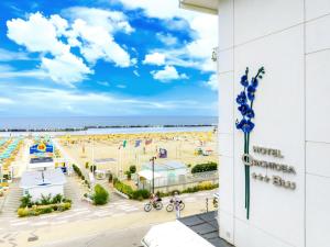 a view of the beach from the balcony of a hotel at Hb Hotels Orchidea Blu in Rimini