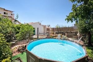 a swimming pool in the yard of a house at Casa Tajinaste in Vilaflor