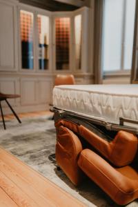 a mattress sitting on top of a couch in a room at Blue Bird Residence Moriaan in Antwerp