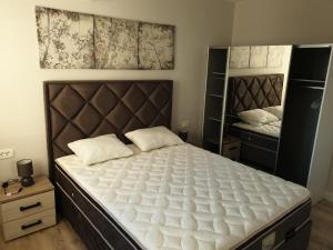 מיטה או מיטות בחדר ב-Family Apartments Stefan