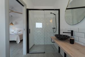 a bathroom with a sink and a mirror at Calas De Meca in Los Caños de Meca