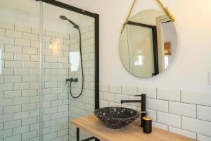 a bathroom with a sink and a mirror at Calas De Meca in Los Caños de Meca