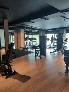 a gym with several chairs and a wooden floor at Apartament Nowa letnica in Gdańsk