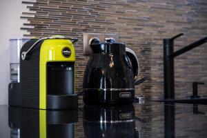 a yellow and black blender sitting on top of a counter at studio Sea Pearl in St. St. Constantine and Helena