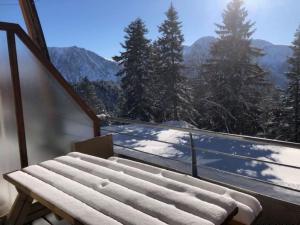 a balcony with a view of a snow covered mountain at V du Bachat Arolles A12 - Appt 6 pers in Chamrousse
