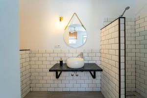 a bathroom with a sink and a mirror at Calas De Meca in Los Caños de Meca