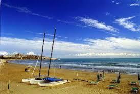 a group of boats sitting on a beach at Hotel Vela Velo Club Vieste in Vieste