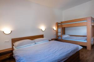Postel nebo postele na pokoji v ubytování VILA Stella