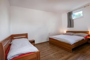 Postel nebo postele na pokoji v ubytování VILA Stella