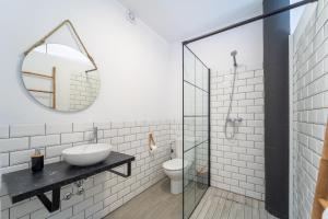 a bathroom with a sink and a mirror at Calas De Meca in Los Caños de Meca