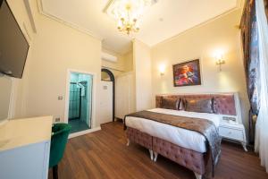 Ein Bett oder Betten in einem Zimmer der Unterkunft Solomon's Mansion Hotel Istanbul