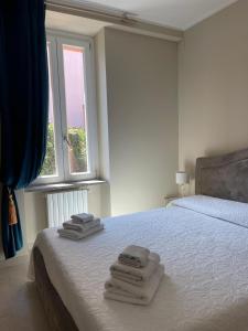 Postel nebo postele na pokoji v ubytování B&B Licia Home