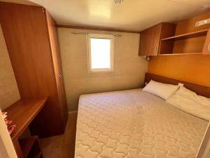 Postel nebo postele na pokoji v ubytování Camping Grande Italia Prestige 1