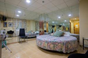 Posteľ alebo postele v izbe v ubytovaní Hotel Beatriz