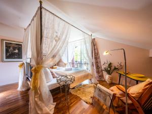 a bedroom with a bed and a large window at Homely Stay in a romantic lodging with sauna&gym in Münsing