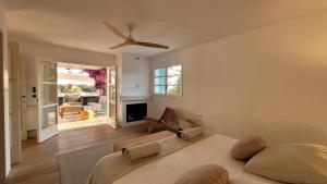 a bedroom with a bed and a ceiling fan at CASA MAGALI in Sant Francesc Xavier