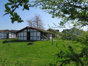 a view of the house from the garden at Ferienhaus Scout 48 im Feriendorf in Hollern-Twielenfleth