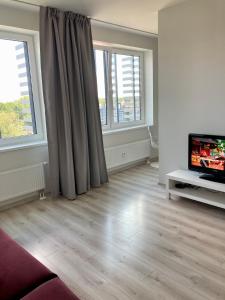 TV a/nebo společenská místnost v ubytování Pepleri Apartment&Parking