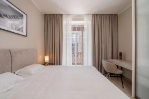 Postel nebo postele na pokoji v ubytování STORIES Design ApartHotel