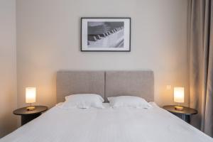 Postel nebo postele na pokoji v ubytování STORIES Design ApartHotel
