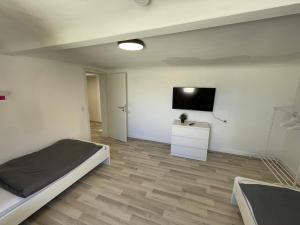 TV a/nebo společenská místnost v ubytování Cozy Apartment in Bad Vilbel