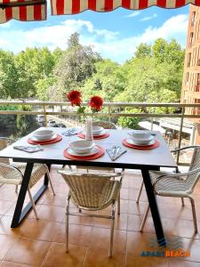 a table on a balcony with a table and chairs at APARTBEACH SANCHO ABARCA CENTRICO y JUNTO PLAYA in Salou
